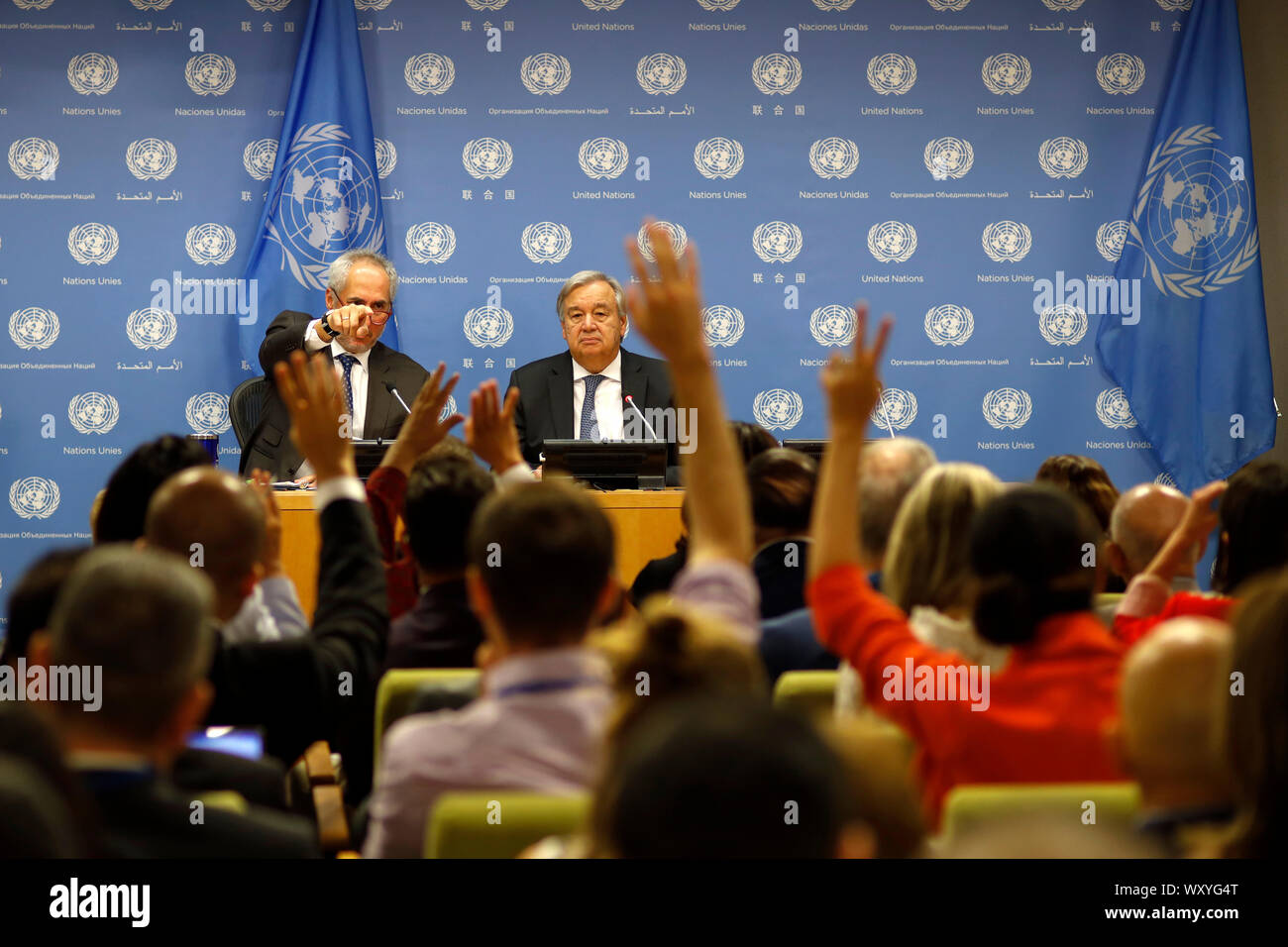 United Nations, UN headquarters in New York. 18th Sep, 2019. UN Secretary-General Antonio Guterres (R, rear) attends a press conference at the UN headquarters in New York, Sept. 18, 2019. The 74th session of the United Nations General Assembly (UNGA 74) will spotlight climate change in the coming days when leaders gather at the UN headquarters in New York to discuss issues of common concern, Antonio Guterres said Wednesday. Credit: Li Muzi/Xinhua/Alamy Live News Stock Photo