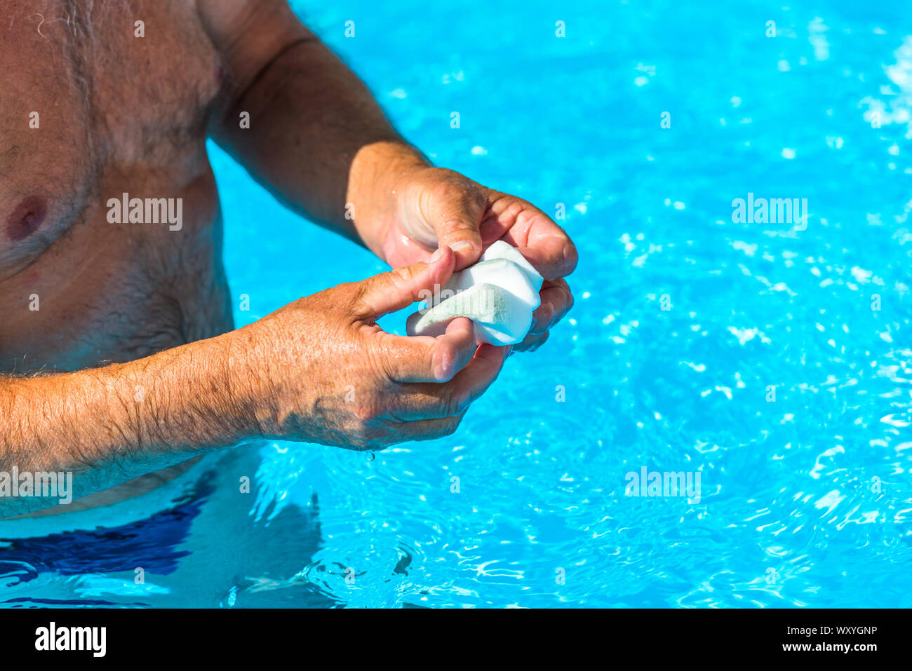 Clean the water line of a pool Stock Photo - Alamy
