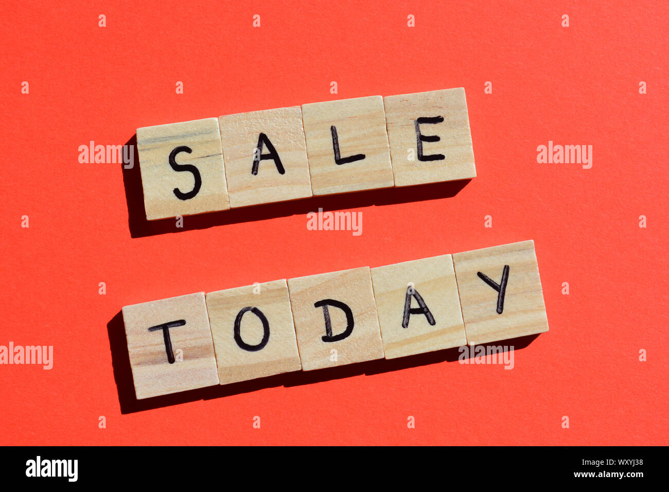 Sale Today in wooden alphabet letters on a red background Stock Photo - Alamy