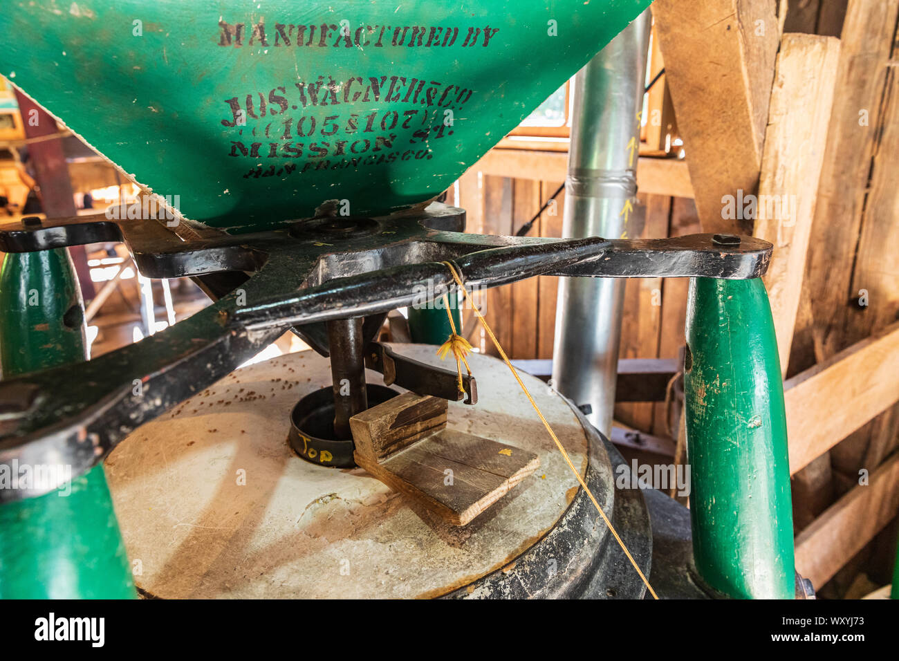 USA, Washington State, Woodland. August 18, 2019. Grain grinding equipment at the Cedar Creek Grist Mill. Stock Photo