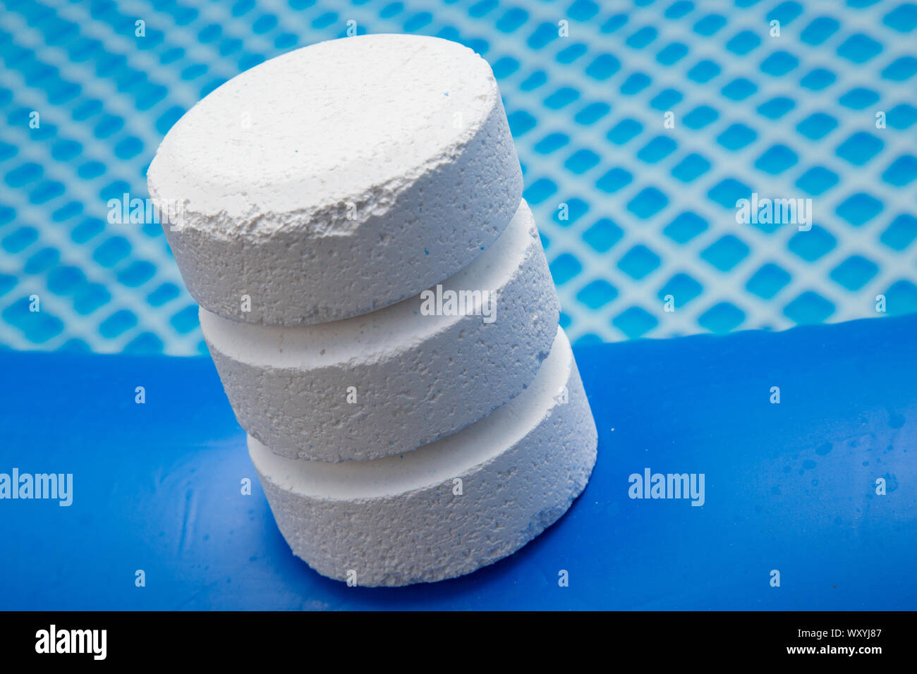 Chlorine Pellets on the edge of an inflatable pool Stock Photo Alamy