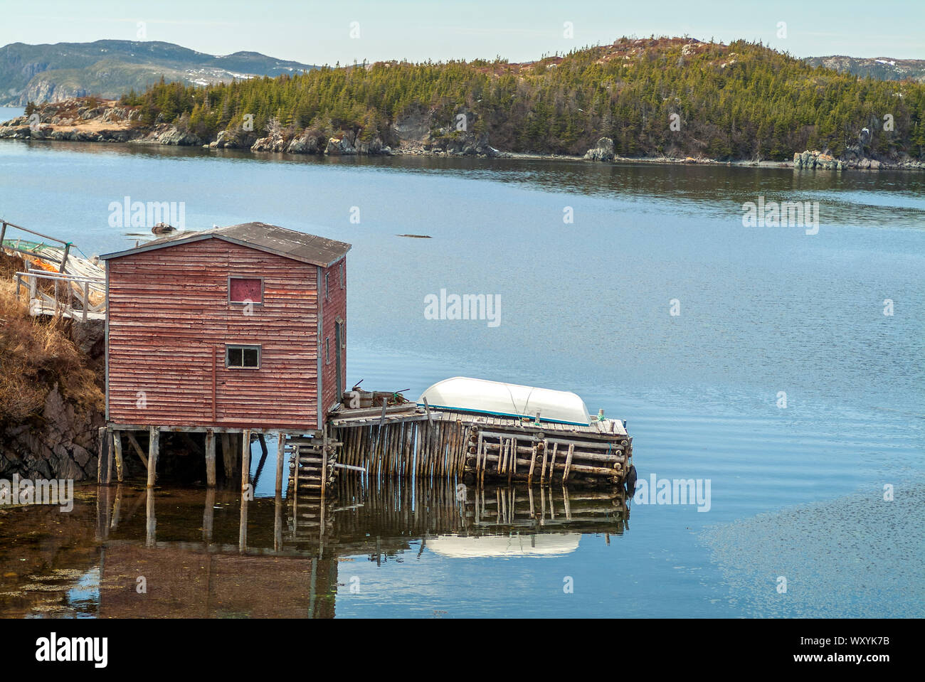 Fishing stage and wharf on calm inlet Stock Photo - Alamy