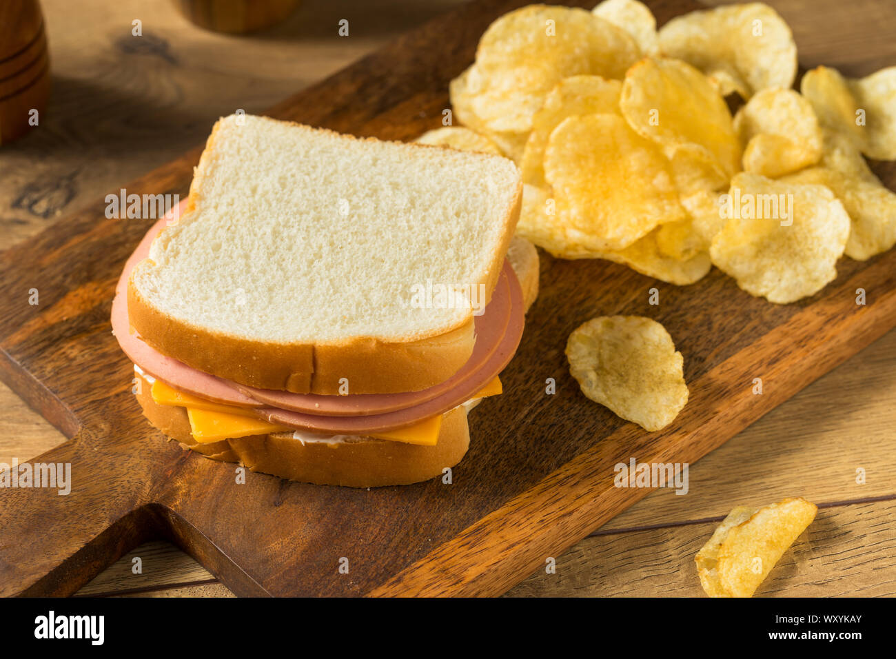 Homemade Bologna and Cheese Sandwich with Chips Stock Photo Alamy