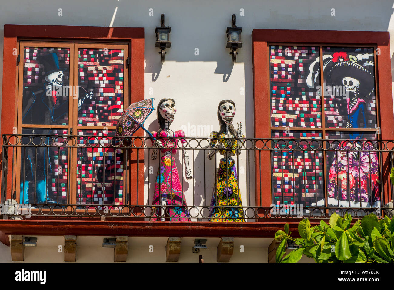 Day of the dead figures on balcony of Malecon shop window, Puerto Vallarta, Jalisco, Mexico. Stock Photo