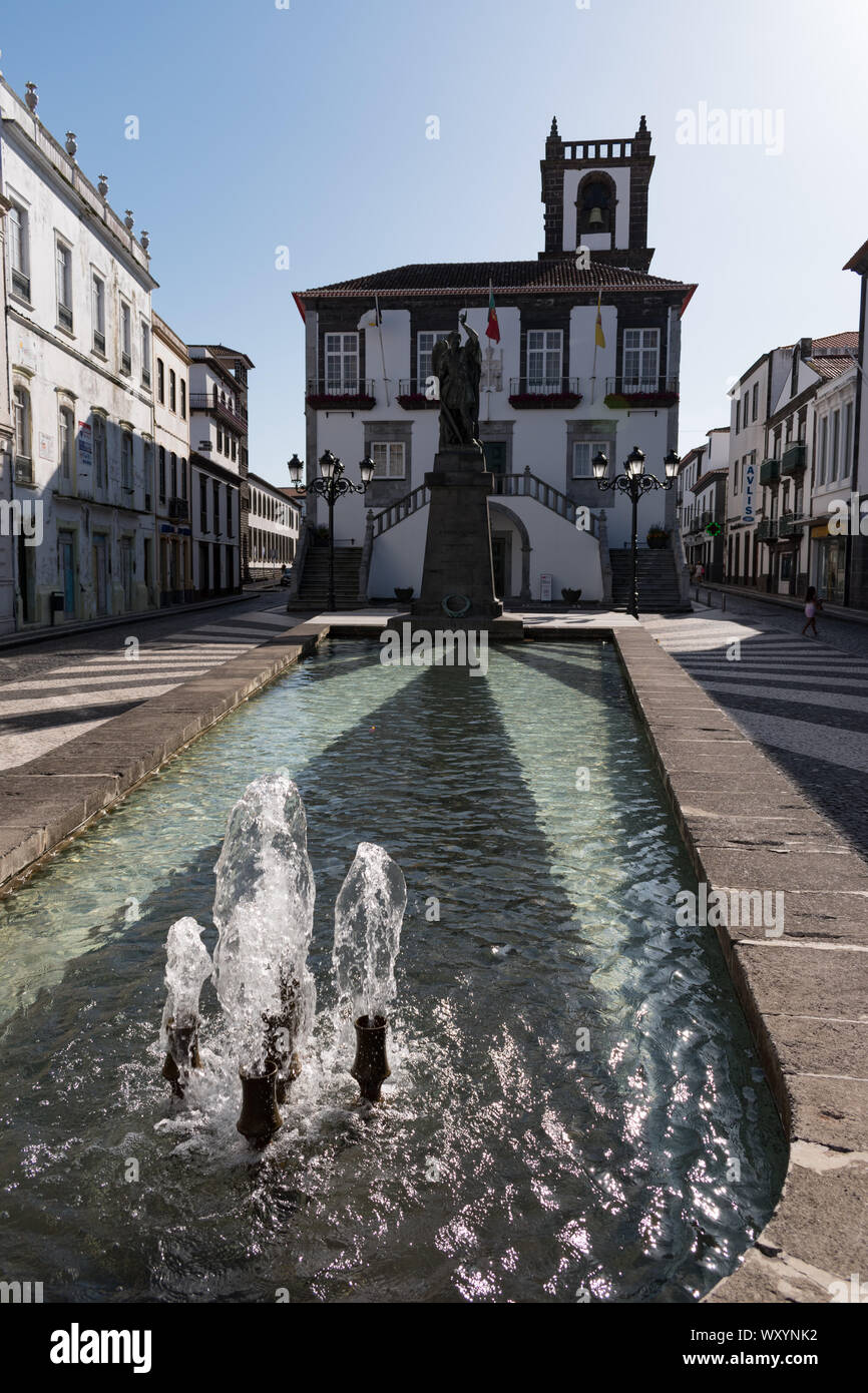Closeup of the fountain and reflecting pool in front of Ponta Delgada City Hall and statue of Archangel Michael in the São Sebastião parish Stock Photo