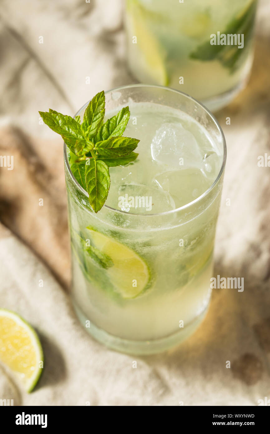 Sweet Mint Rum Mojito with Limes and Soda Water Stock Photo