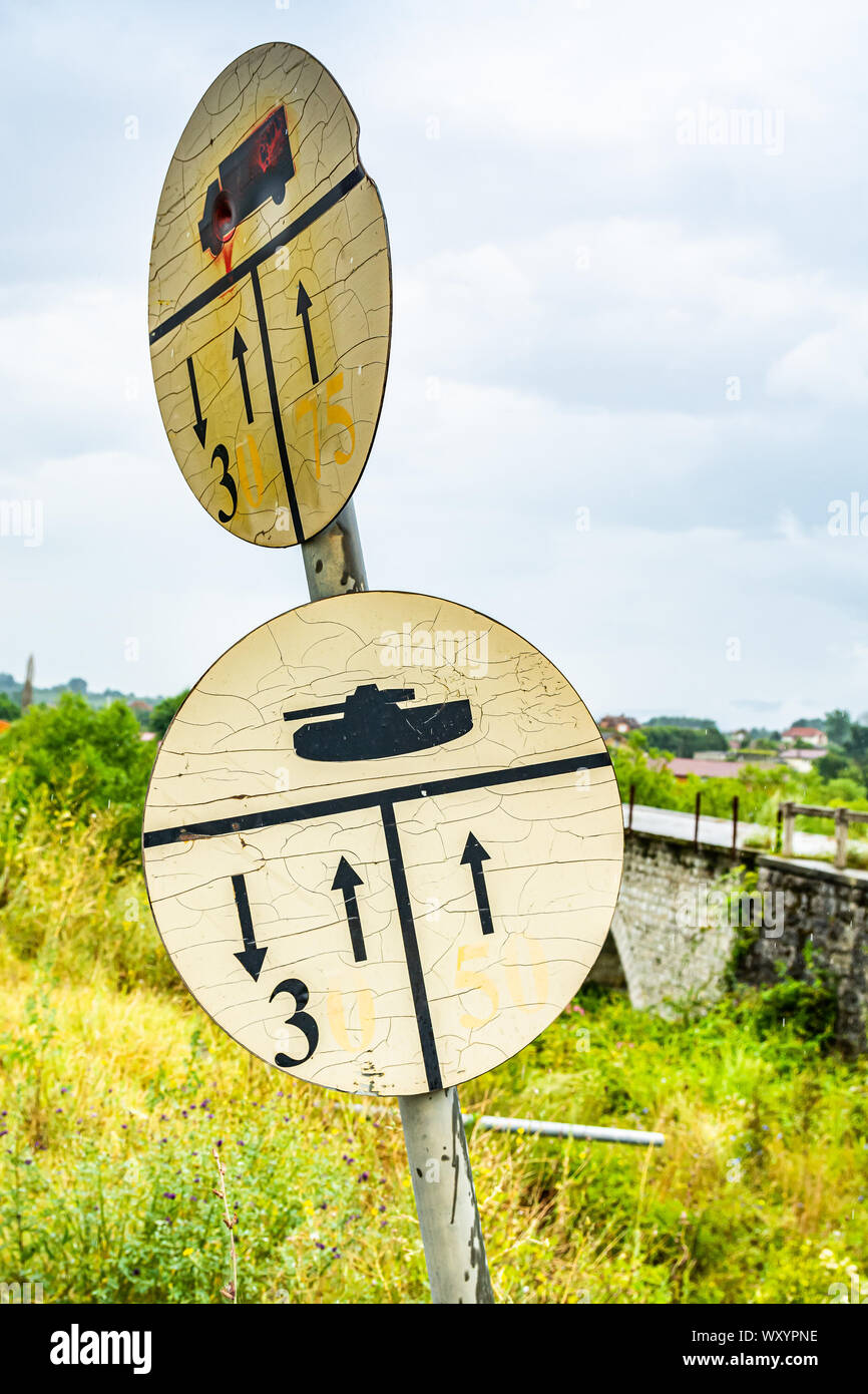 Direction sign with specifications for army tanks - speed data in traffic Stock Photo