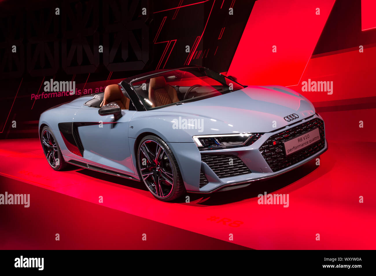 New gray Audi R8 V10 performance quattro cabriolet car presented at IAA 2019 against red background Stock Photo