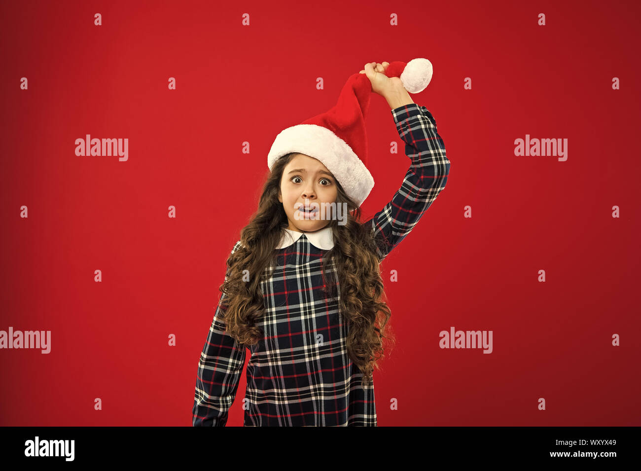 Happy winter holidays. Small surprised girl. Present for Xmas ...