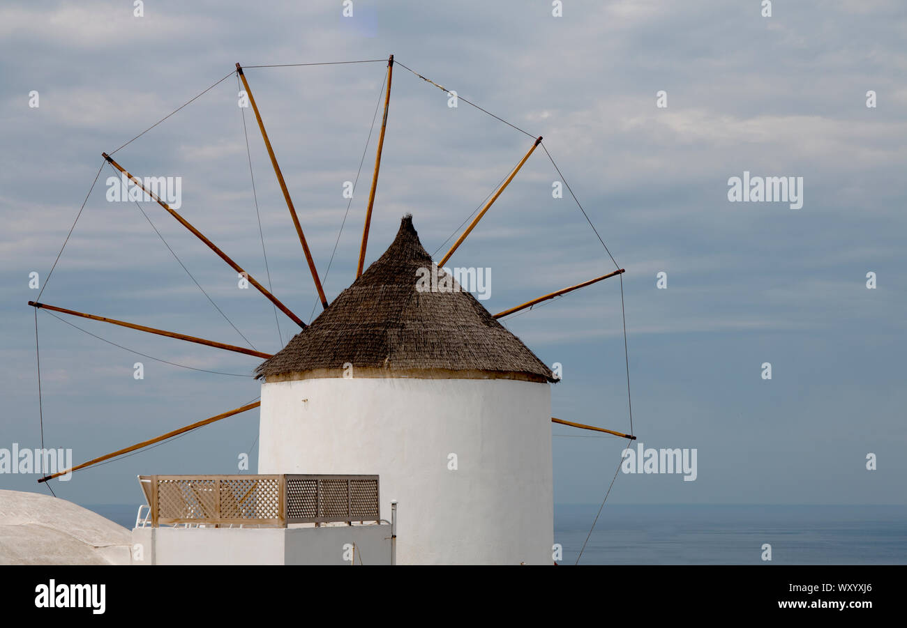 The unique style of a Grecian windmill, this on the island of Santorini in the Greek Islands Stock Photo