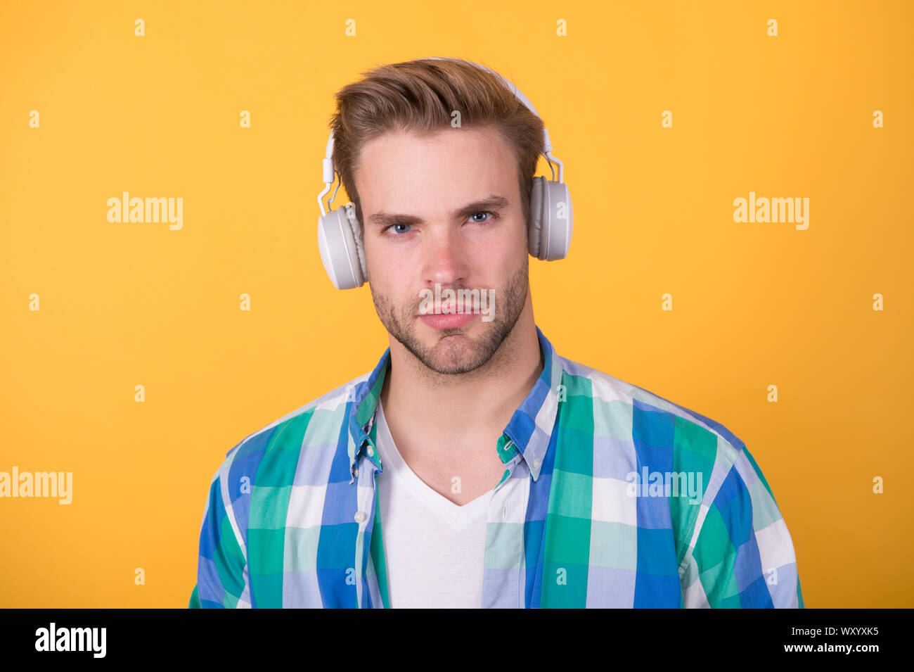 Stereo sound. Hipster listen music. Music taste. Man in earphones. Mp3  player. Education audio book. Modern technology. Handsome radio host. Music  chart. Creating sound and songs. Recording sample Stock Photo - Alamy