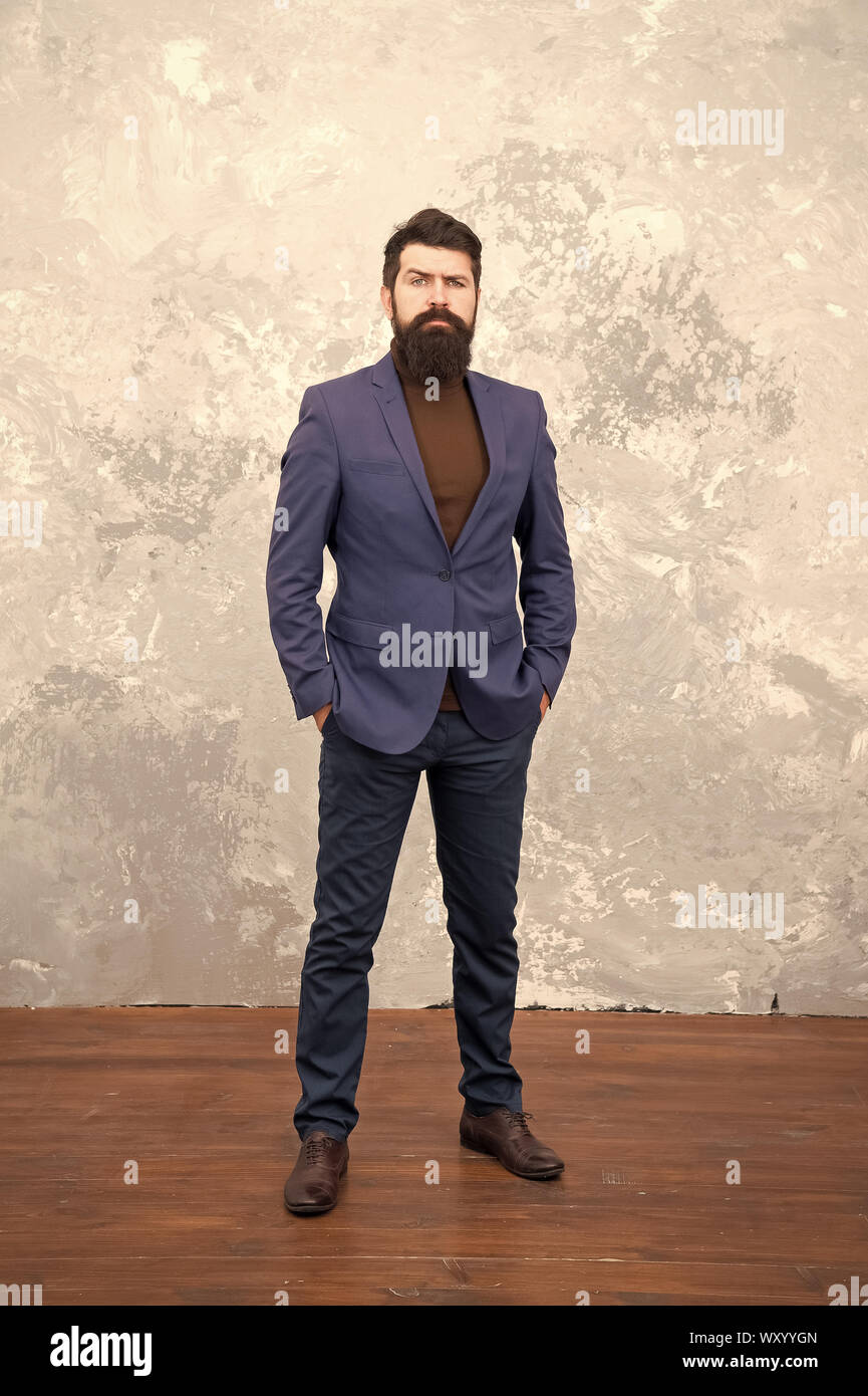 Classy style. Man bearded hipster wear classic suit outfit. Formal outfit.  Take good care of suit. Elegancy and male style. Businessman or host  fashionable outfit grey background. Fashion concept Stock Photo -