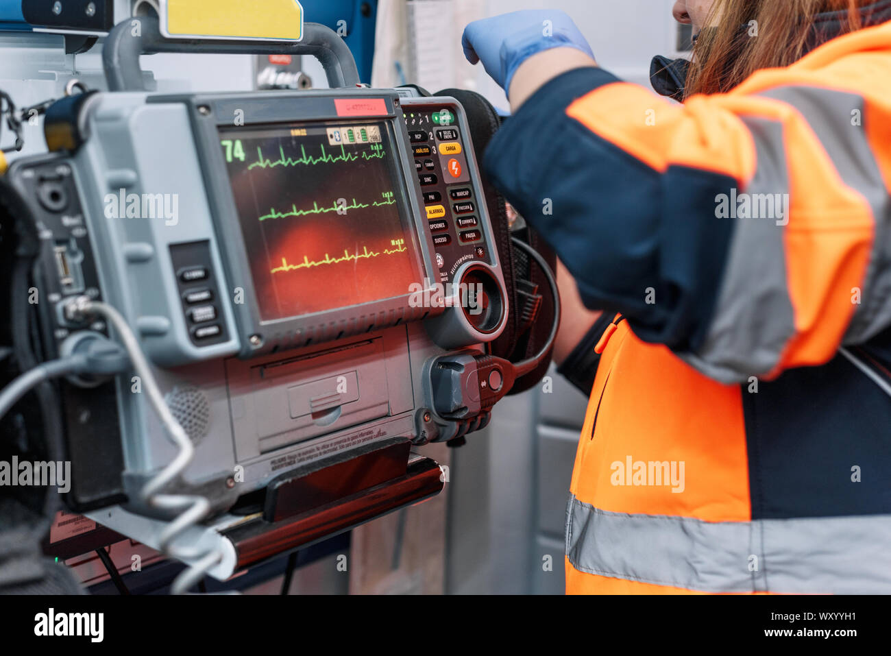 Medical urgency in the ambulance. Emergency doctor using defibrillator Stock Photo Alamy