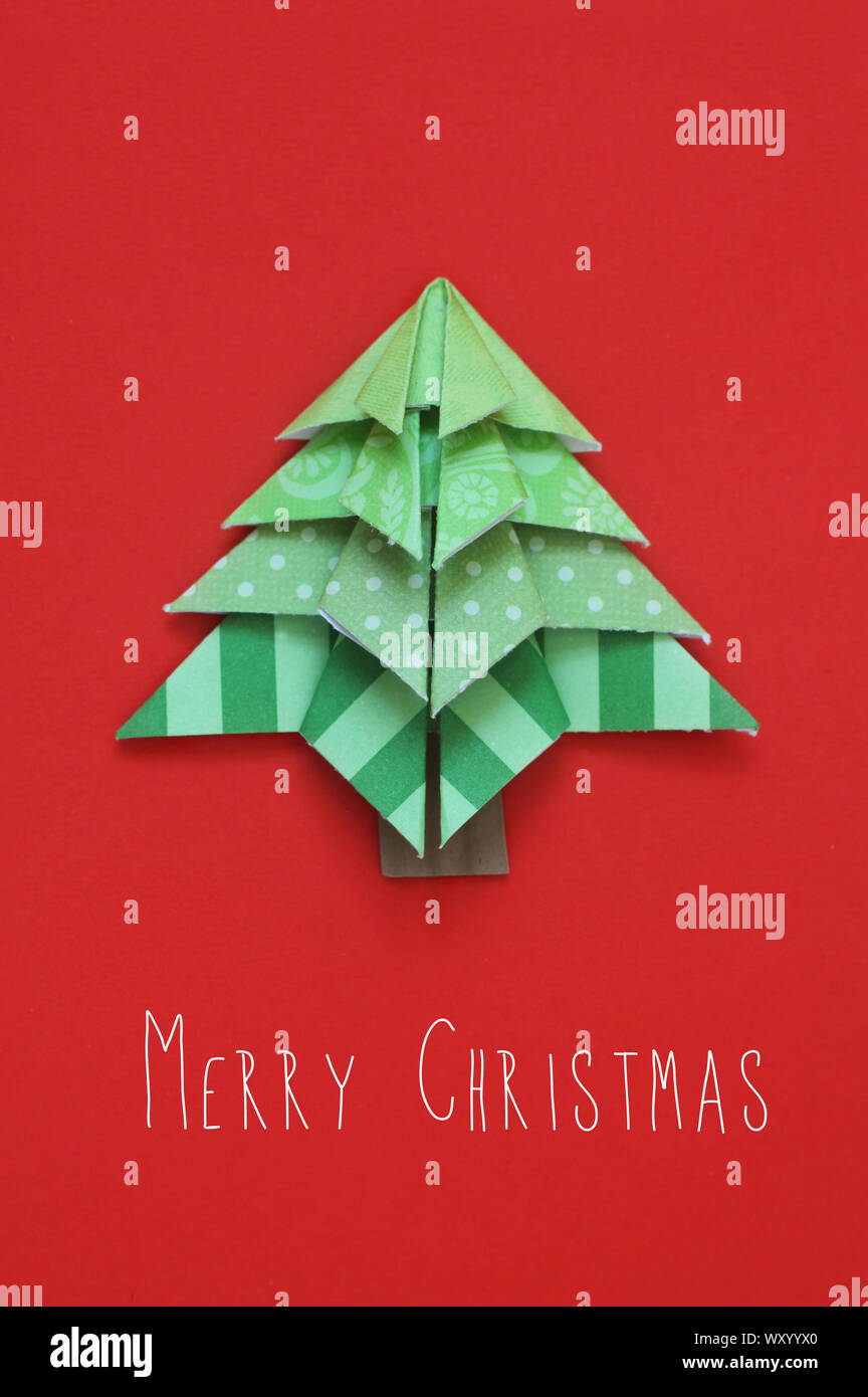 Origami Christmas Tree On Red Stock Photo - Alamy