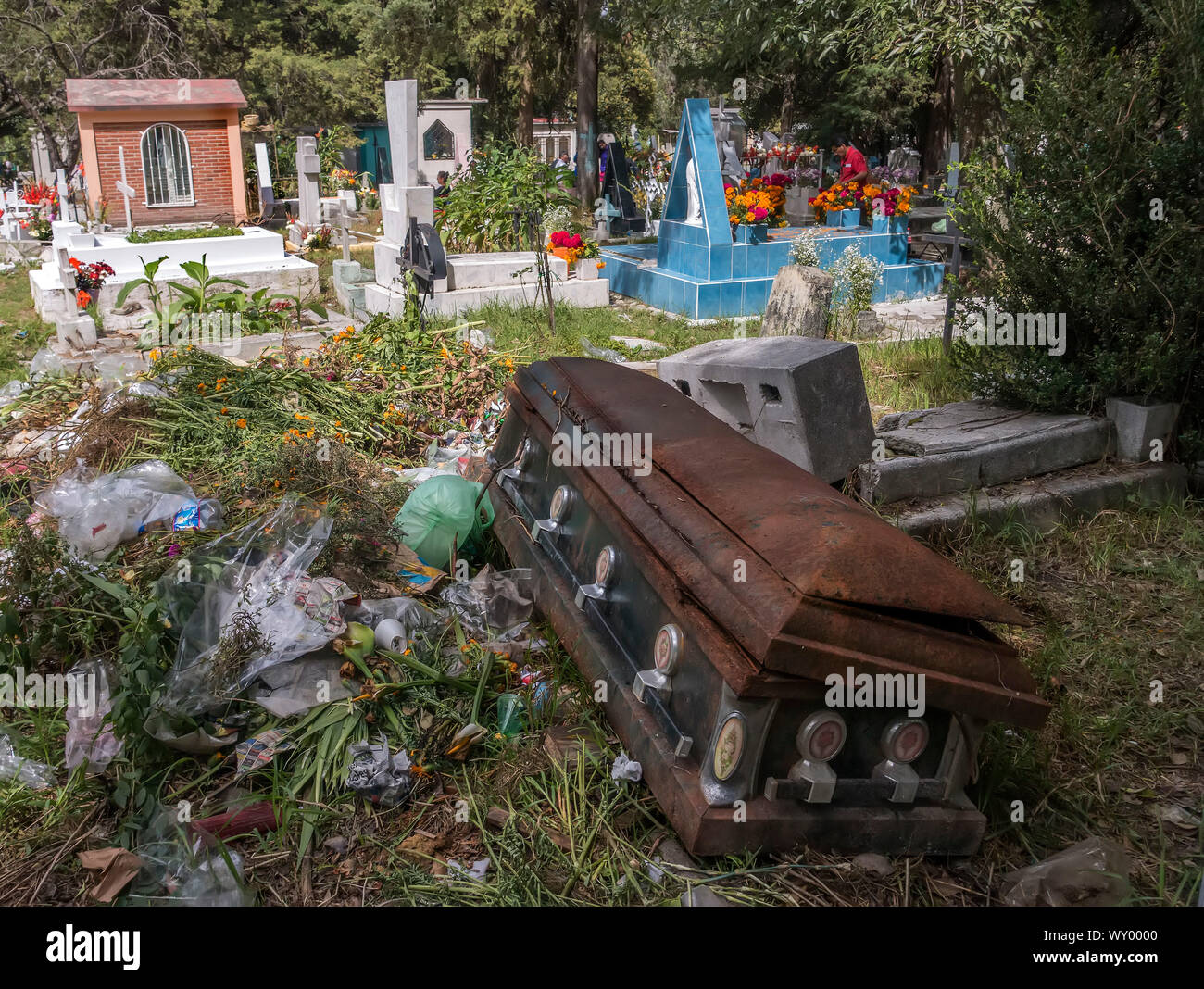 Coffin thrown out with trash in clean up of cemetery for the Day of the Dead in Mexico City, Mexico Stock Photo