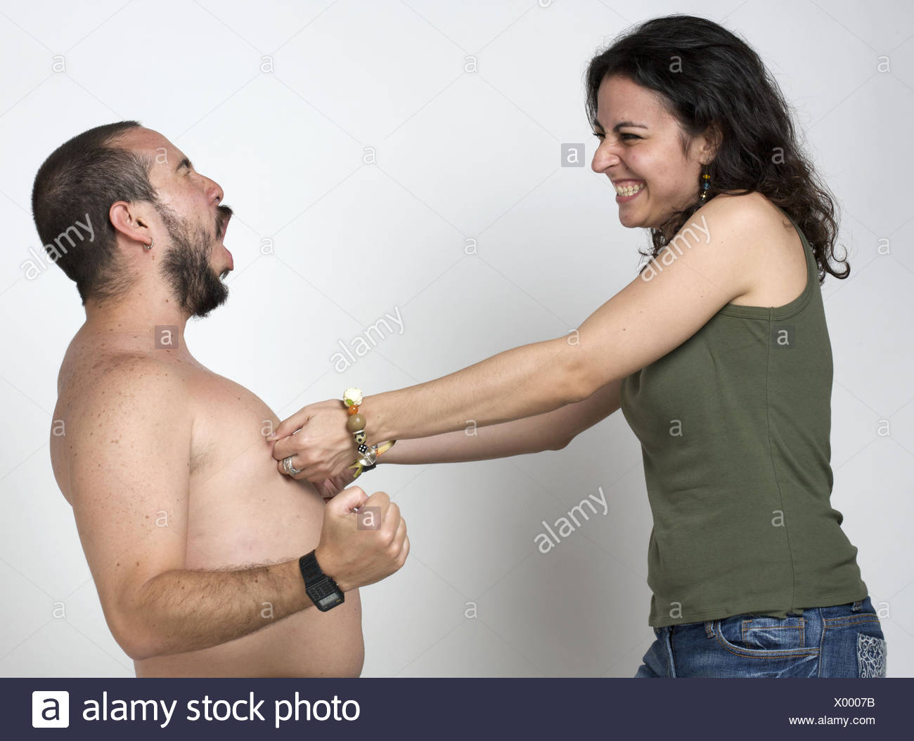 Young Newlywed Girl Pinching Her Husbands Nipples Stock Image Young Newlywed Girl Pinching Her Husbands Nipples Stock Image