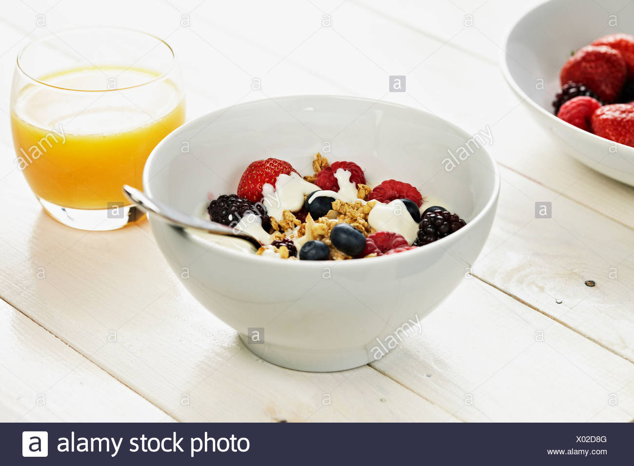 Bowl Of Cereal And Orange Juice High Resolution Stock Photography and