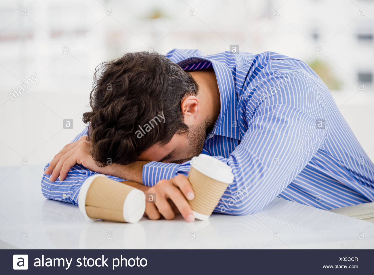 Businessman Putting His Head Down On Desk Stock Photo 275441511