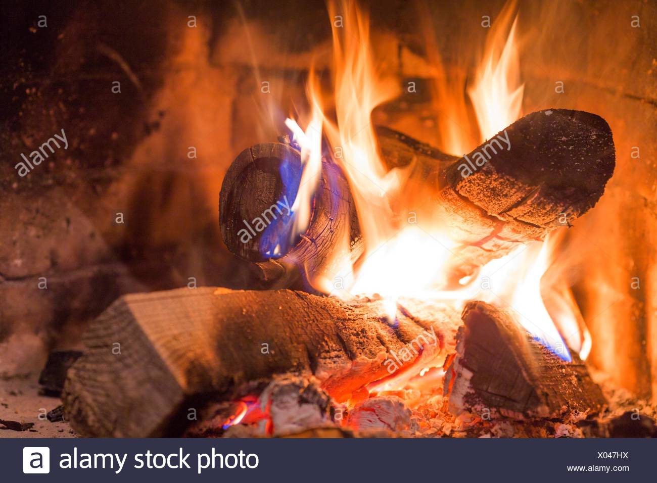 Firewood Burning In Fireplace Fire Flame Red Ashes Stock Photo