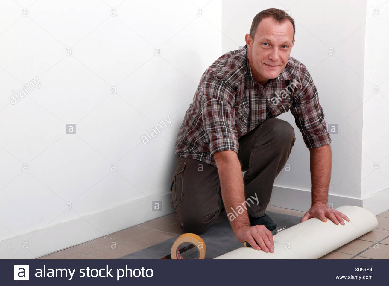 Man Fitting Linoleum Floor Stock Photos Man Fitting Linoleum