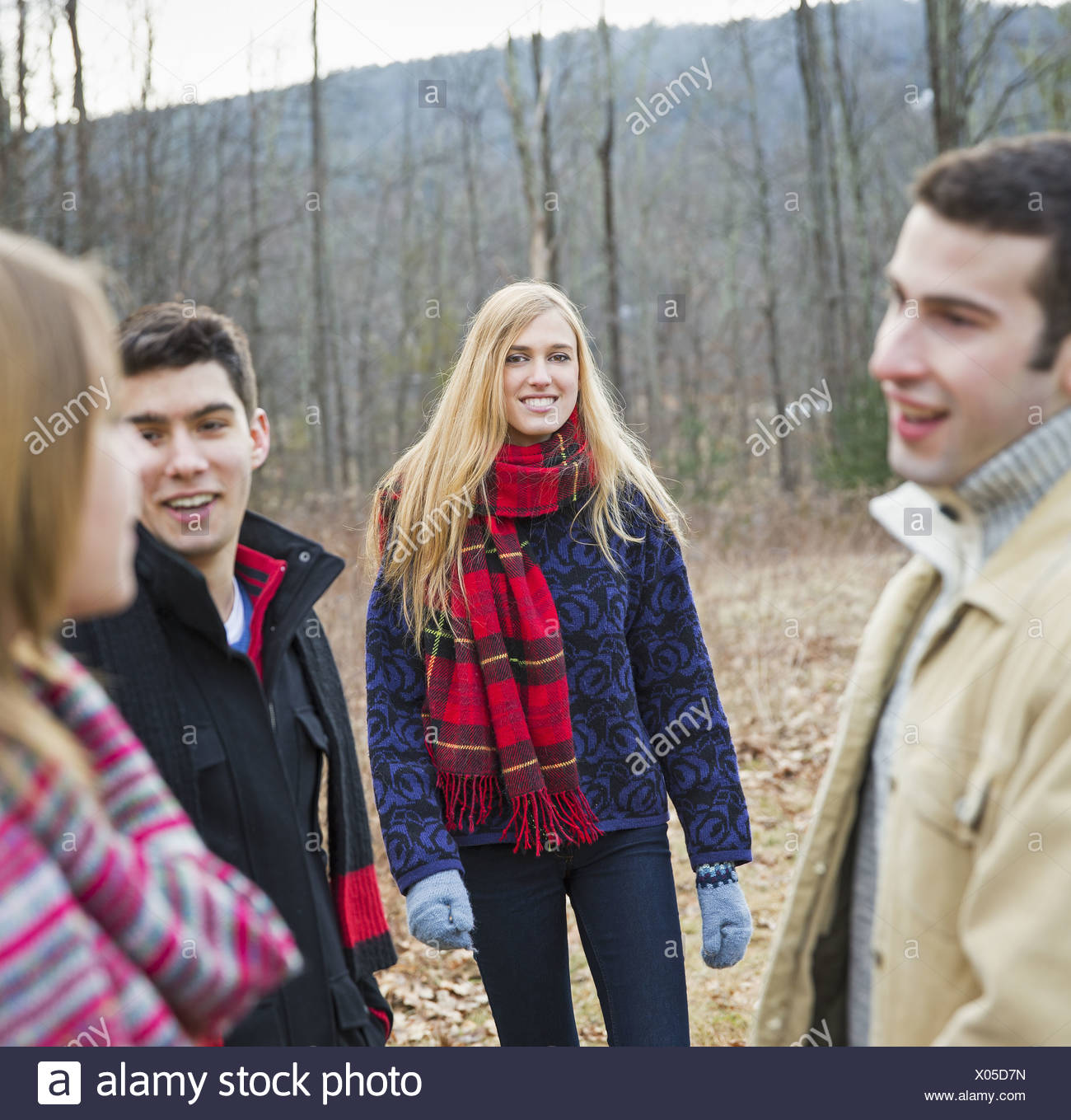 A group of four people outdoors on a winter day. Stock Photo