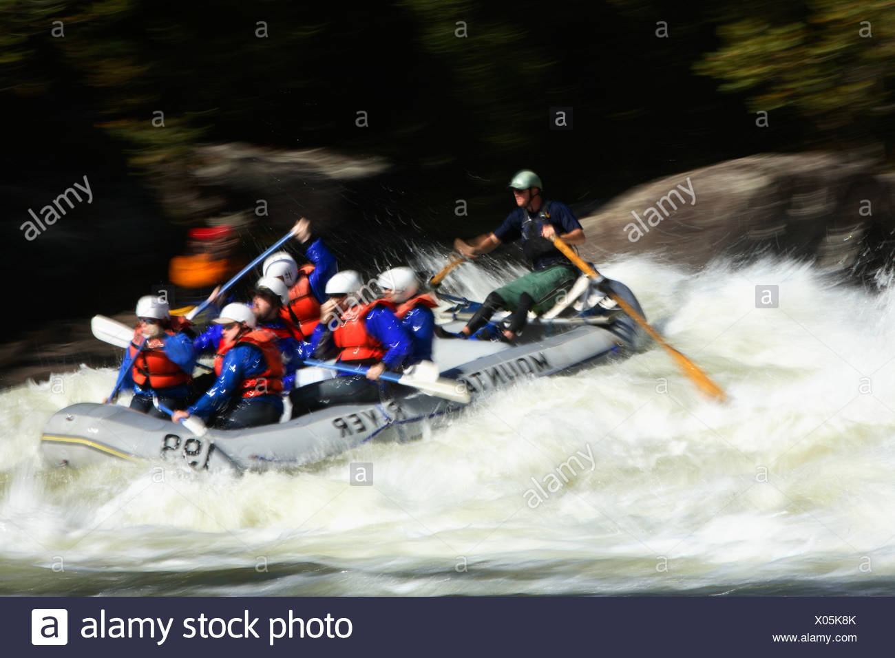 Motion Blur Photo Of Unknown Whitewater Rafters Crashing Through