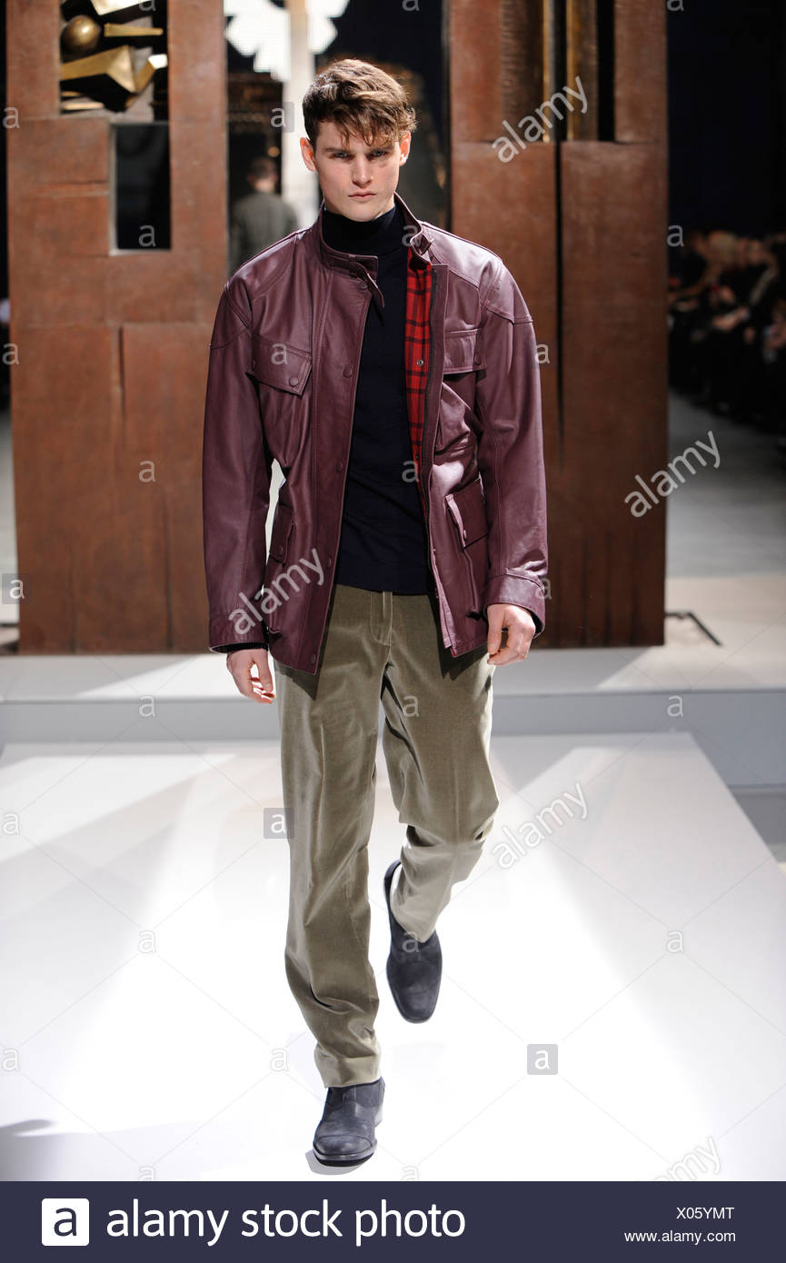 Belstaff Milan Menswear Ready to Wear Autumn Winter Burgundy red leather  jacket, black polo neck and olive velvet trousers Stock Photo - Alamy