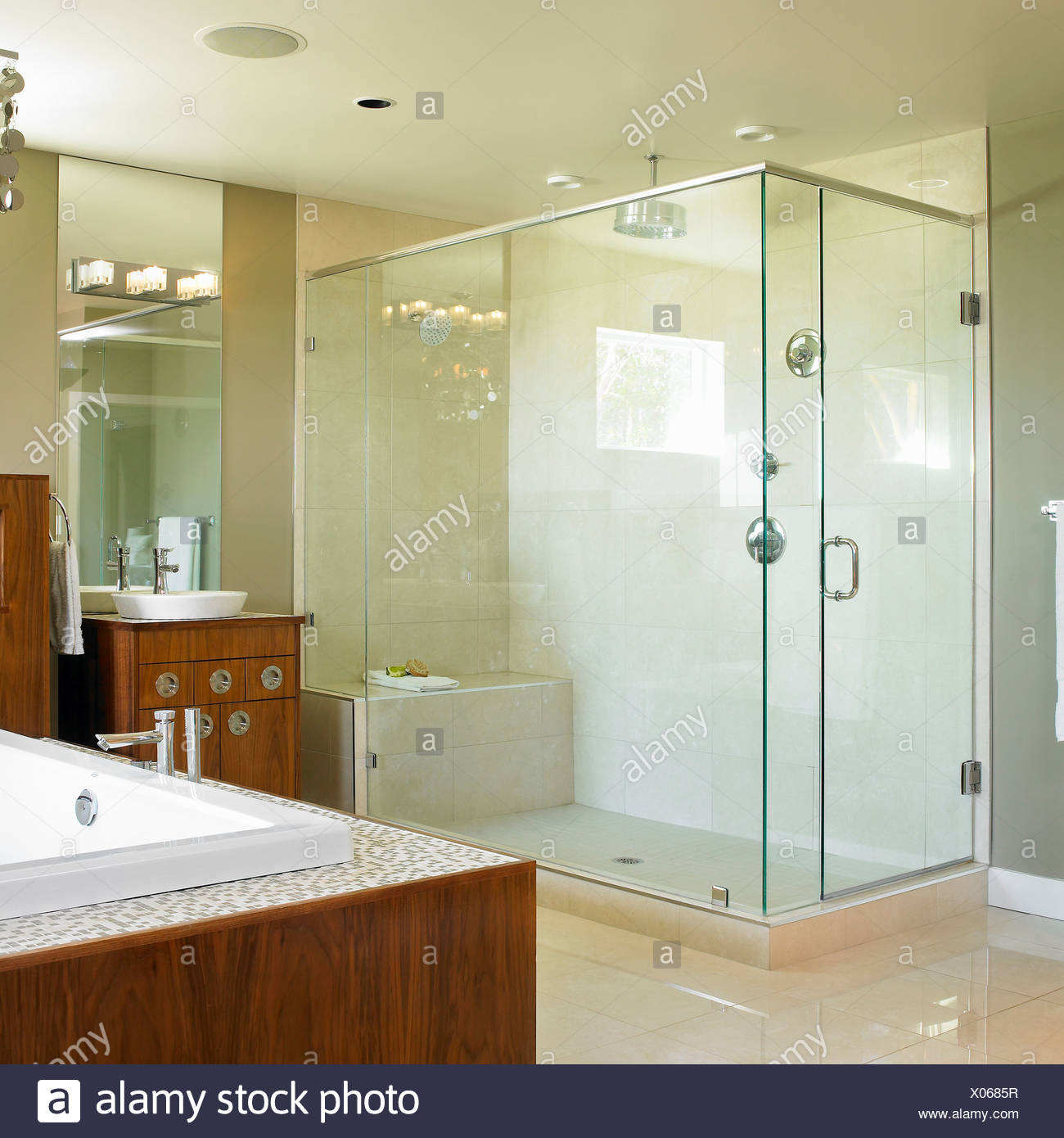 Neutral Modern Bathroom With Large Glass Shower And Wood Cabinets