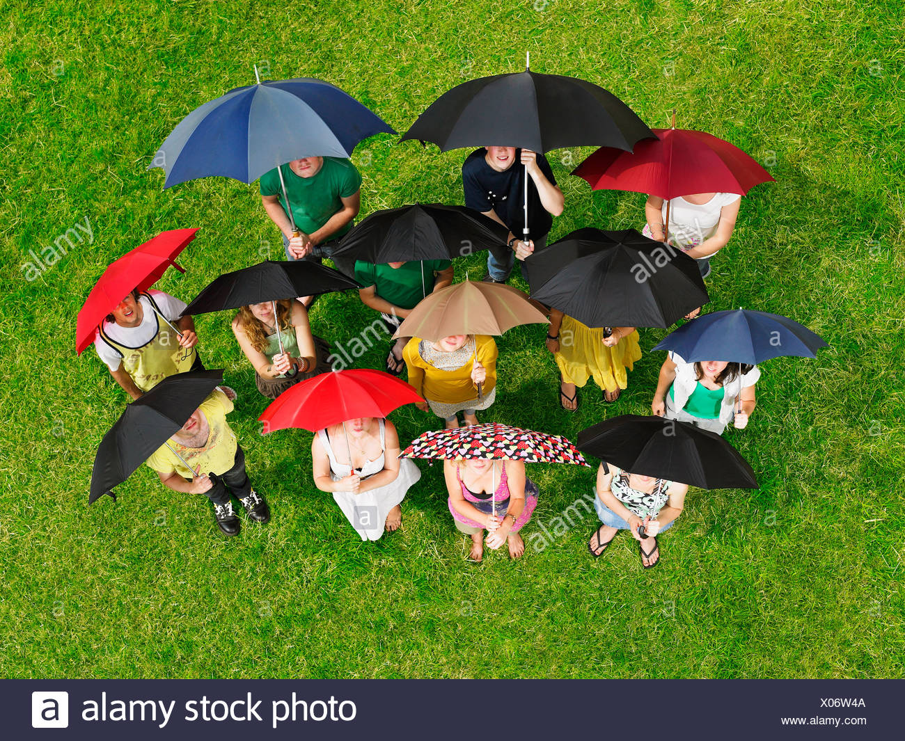 People Holding Umbrellas Stock Photos & People Holding Umbrellas Stock