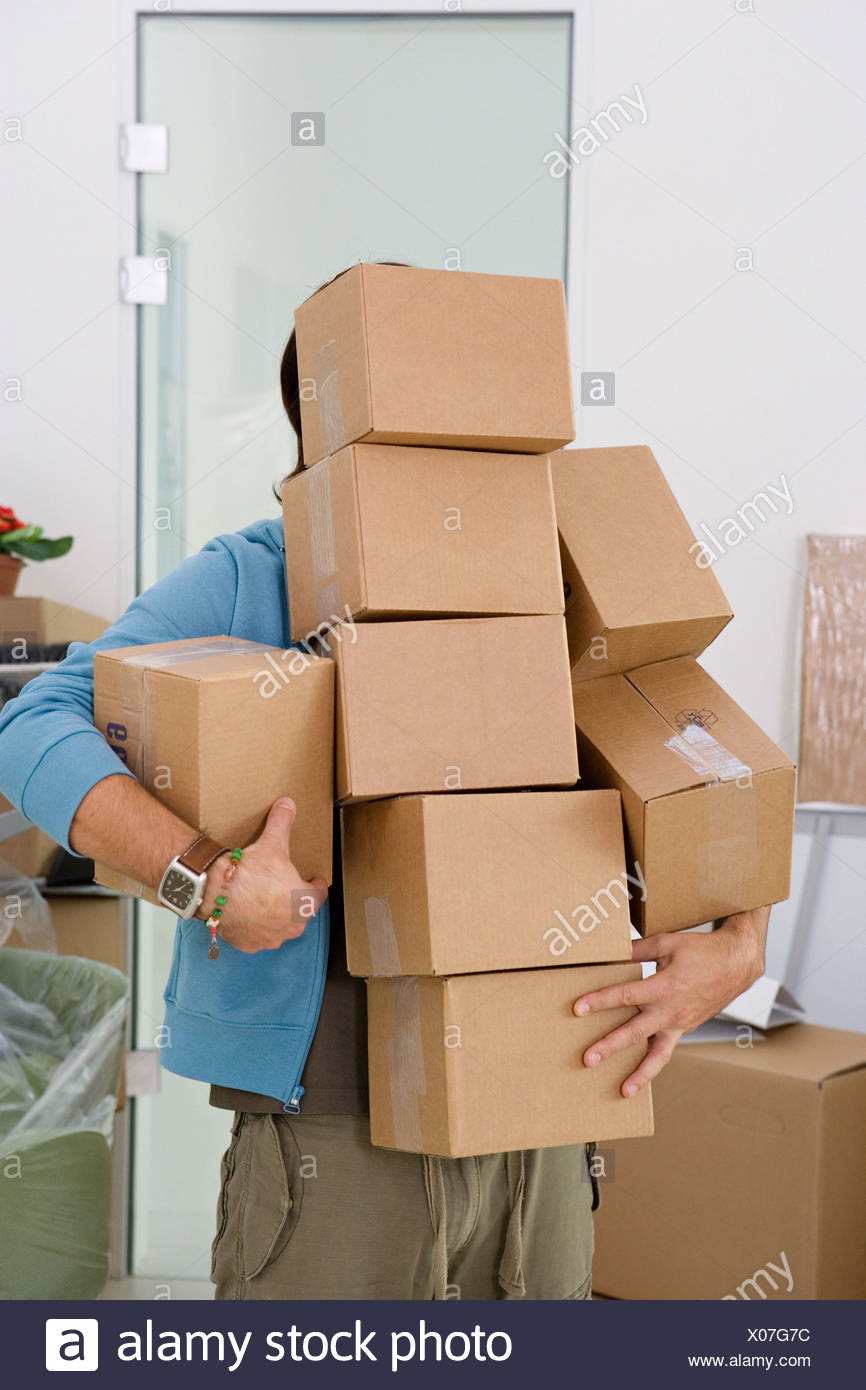 Holding Lots Of Boxes Stock Photos & Holding Lots Of Boxes Stock Images