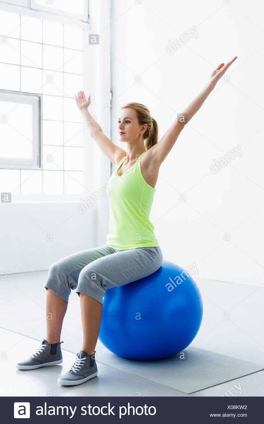 sitting on a swiss ball