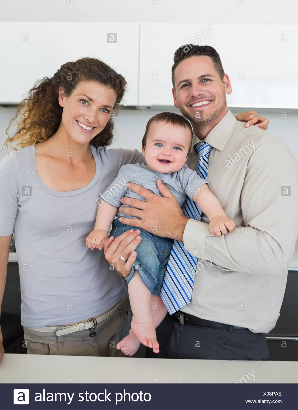 Loving Young Parents With Cute Infant Child Enjoying Summer Weekend Together In Green Park Stock Photo Alamy