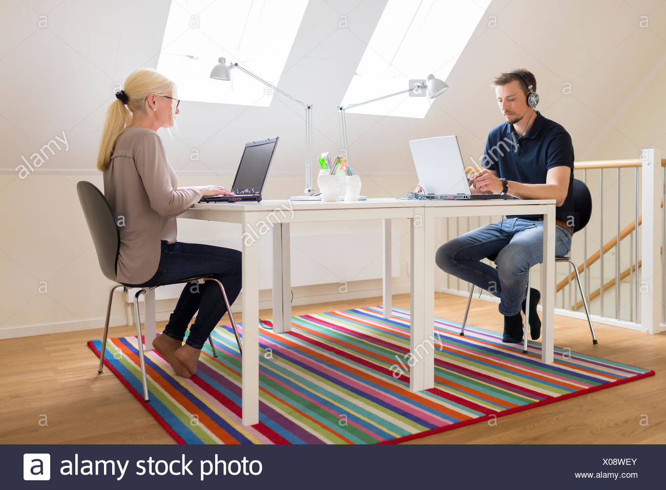 Sweden, Couple working at home Stock Photo