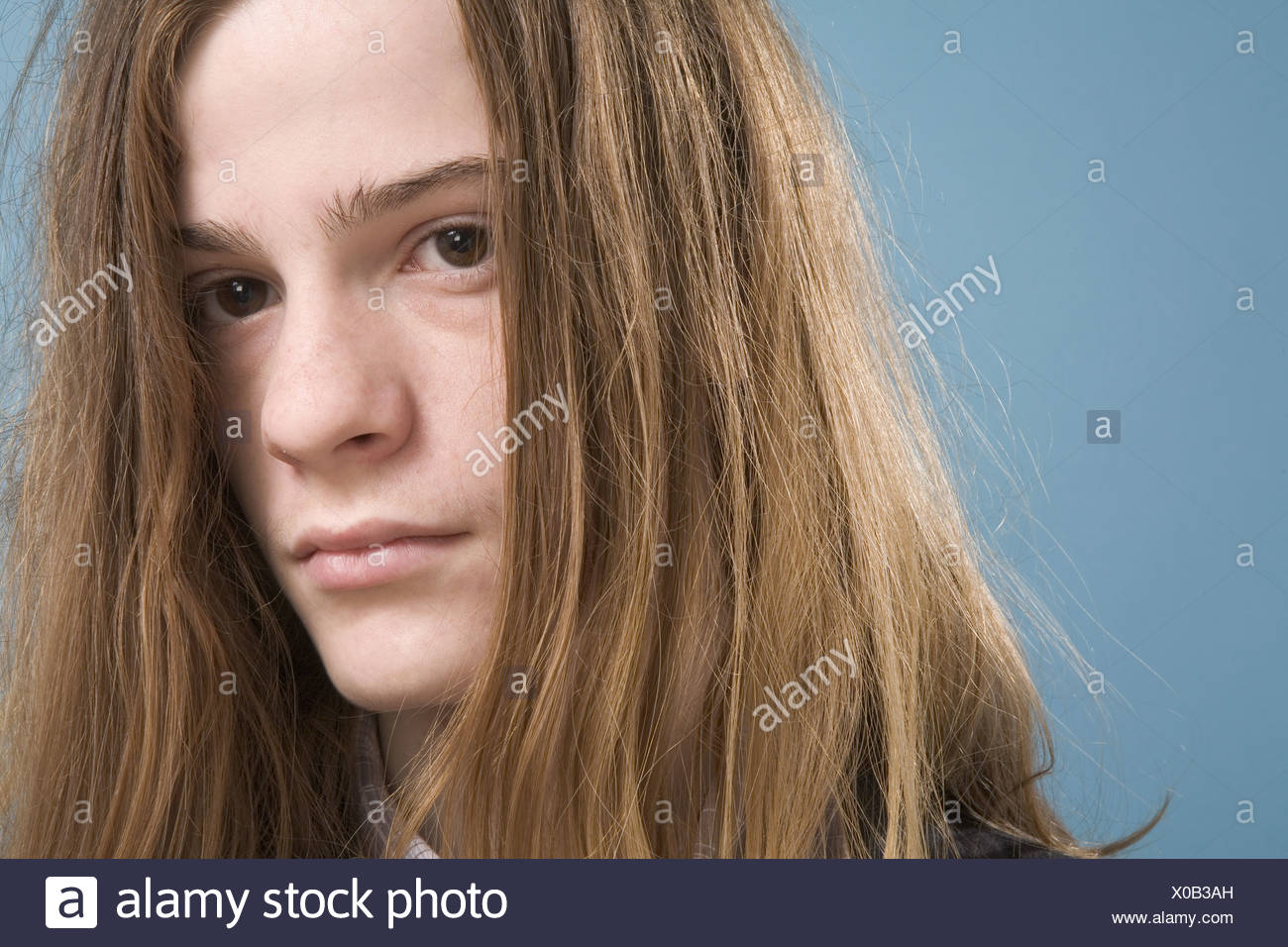 Teen Boy With Long Hair Stock Photo Alamy