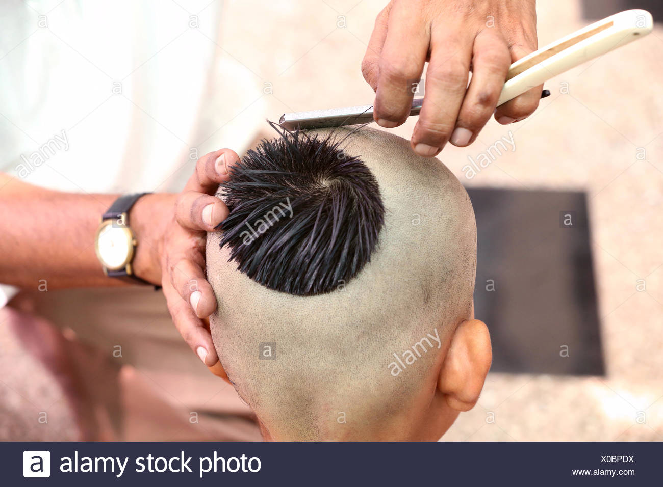 Getting a hair-cut for thread ceremony, Upanayana, a Hindu ritual