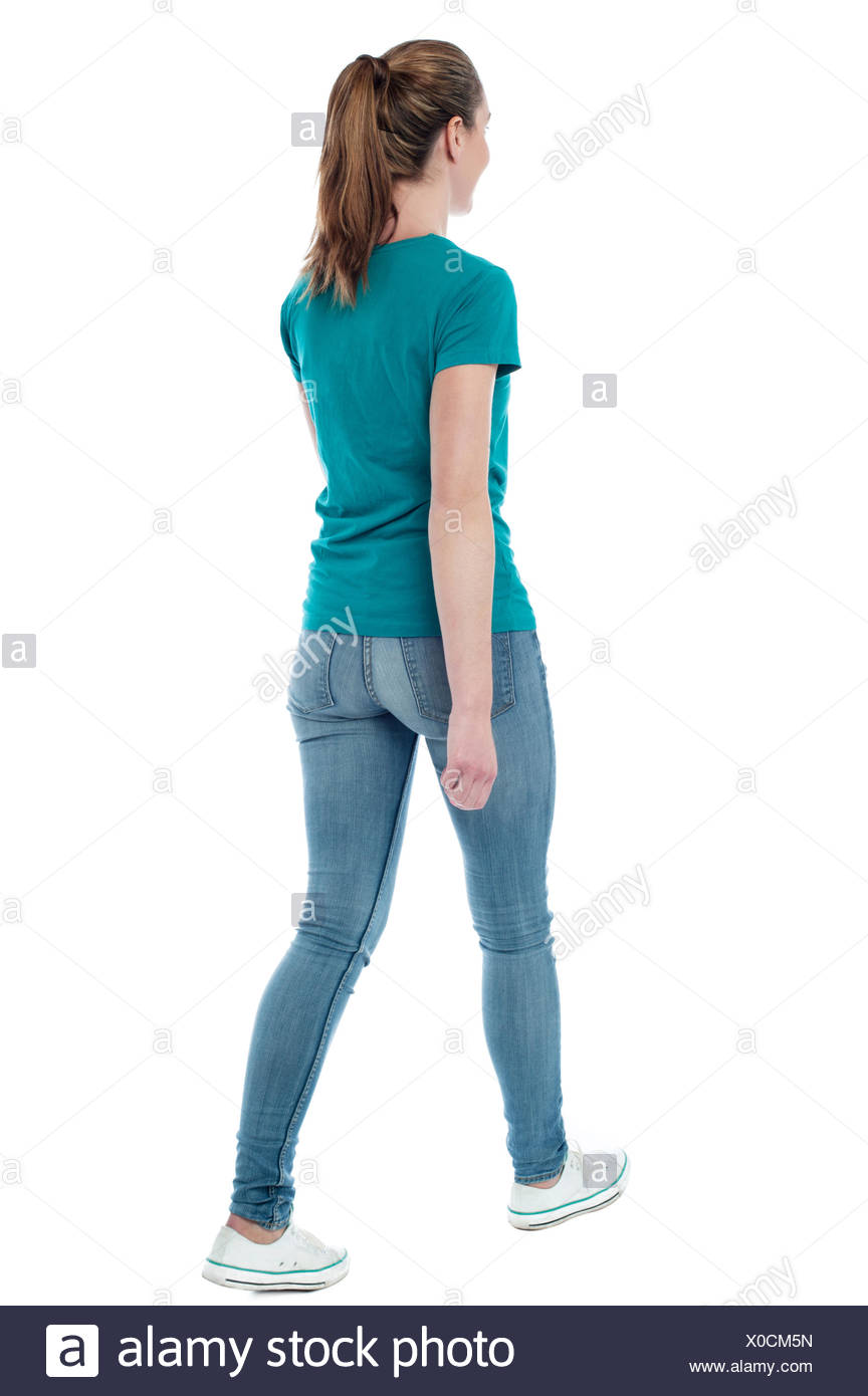 Casual woman walking away from the camera Stock Photo ...