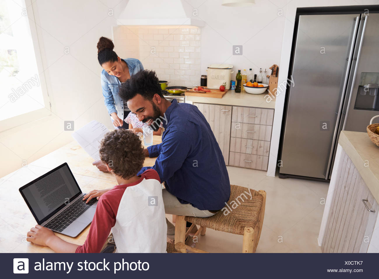 Parents Helping Kids Homework In Kitchen High Resolution Stock Photography And Images Alamy Parents Helping Kids Homework In Kitchen High Resolution Stock Photography And Images Alamy