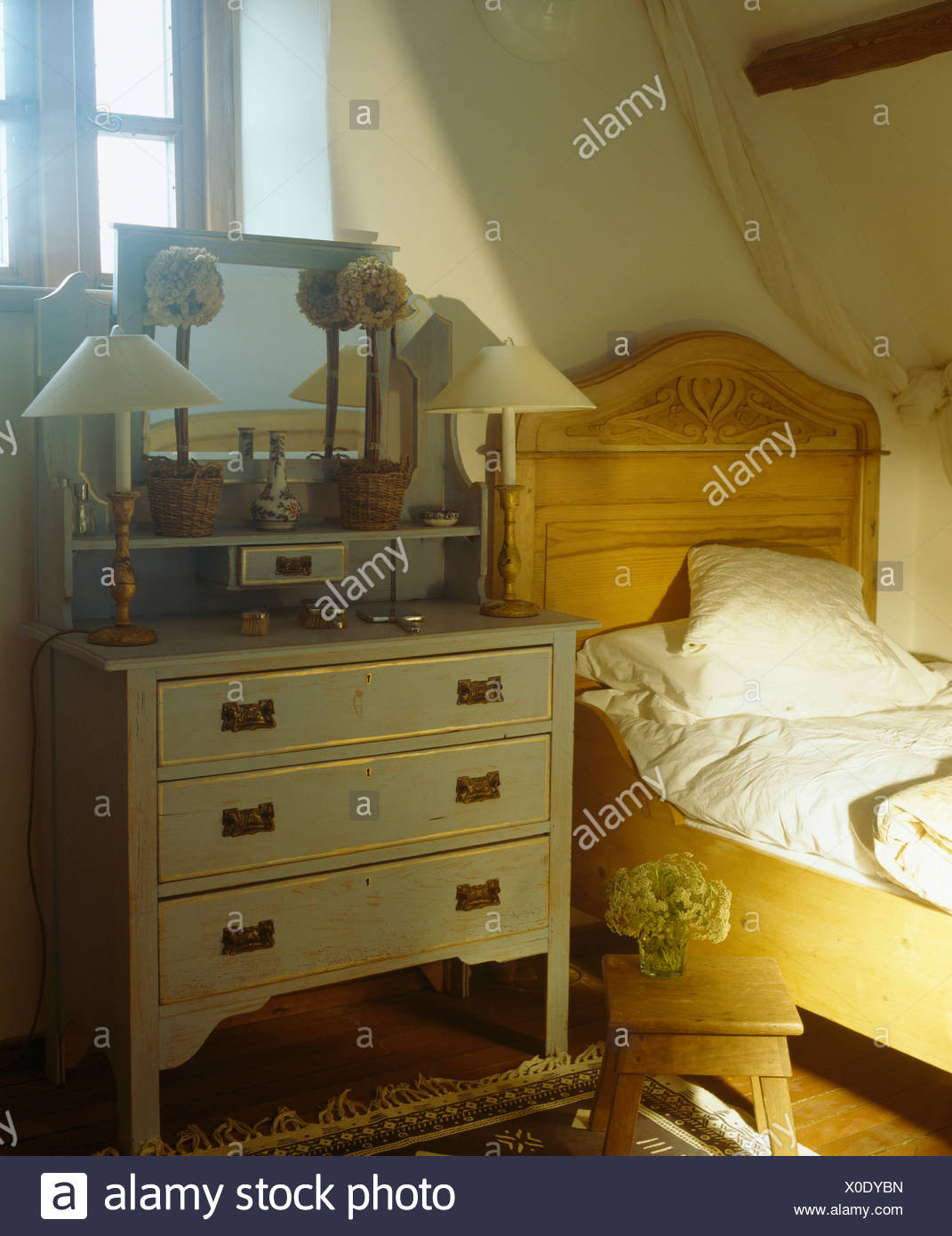 Single Pine Bed Beside Blue Painted Chest Of Drawers In Small
