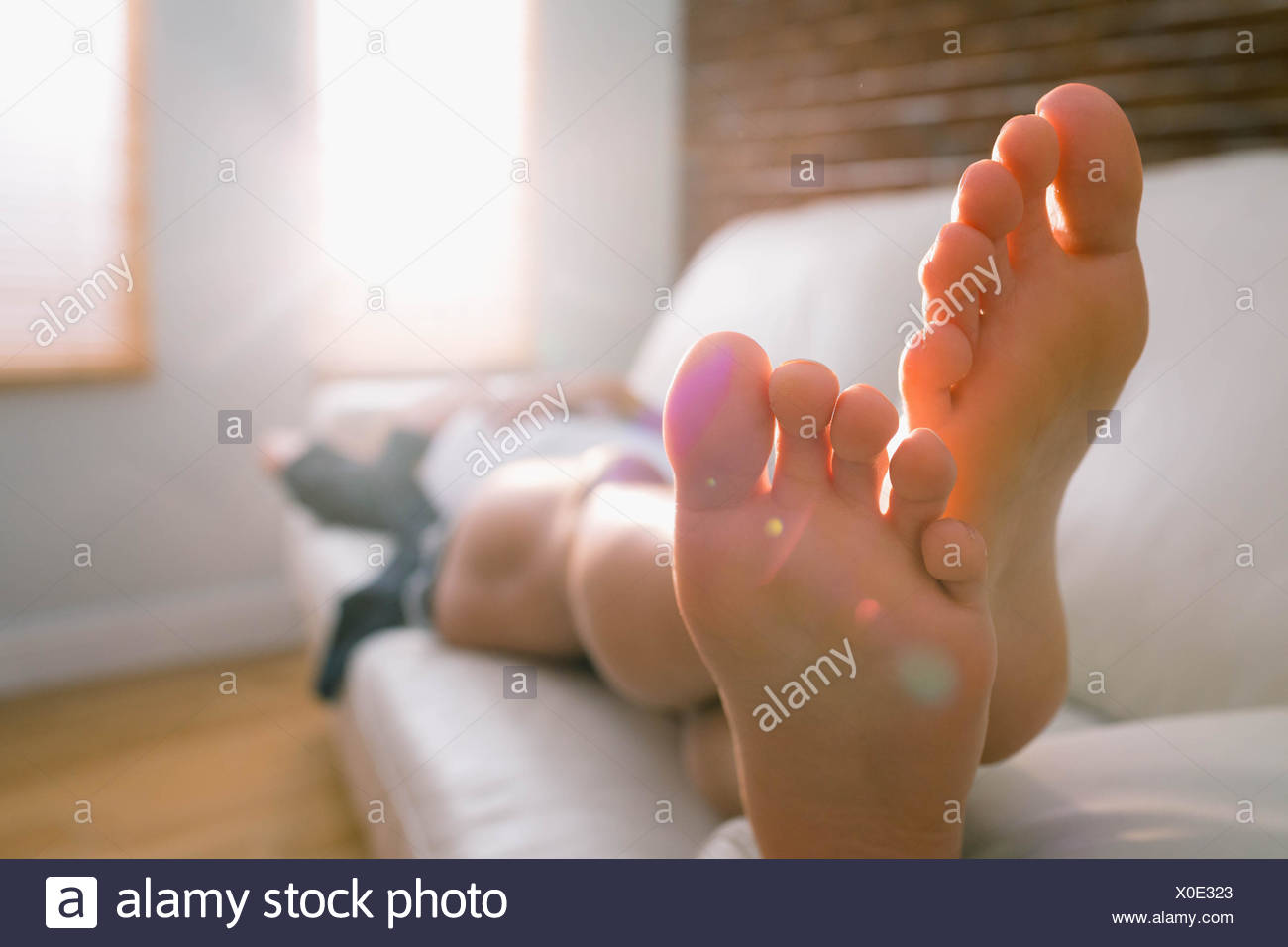Adult Couch Feet Home House High Resolution Stock Photography and ...