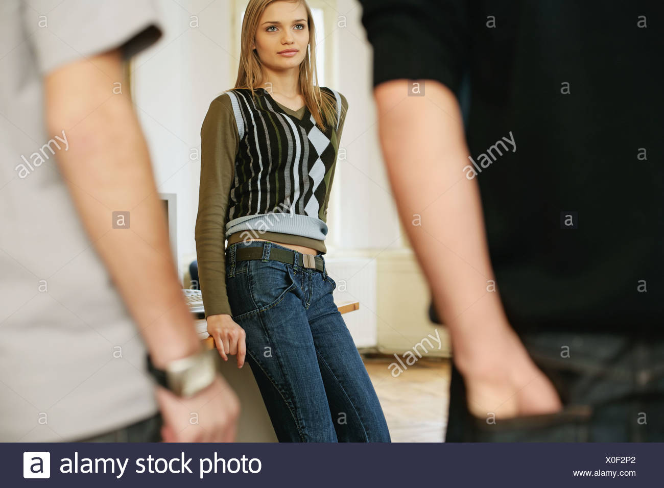 Two Young Men Approaching A Young Woman Stock Image Two Young Men Approaching A Young Woman Stock Image