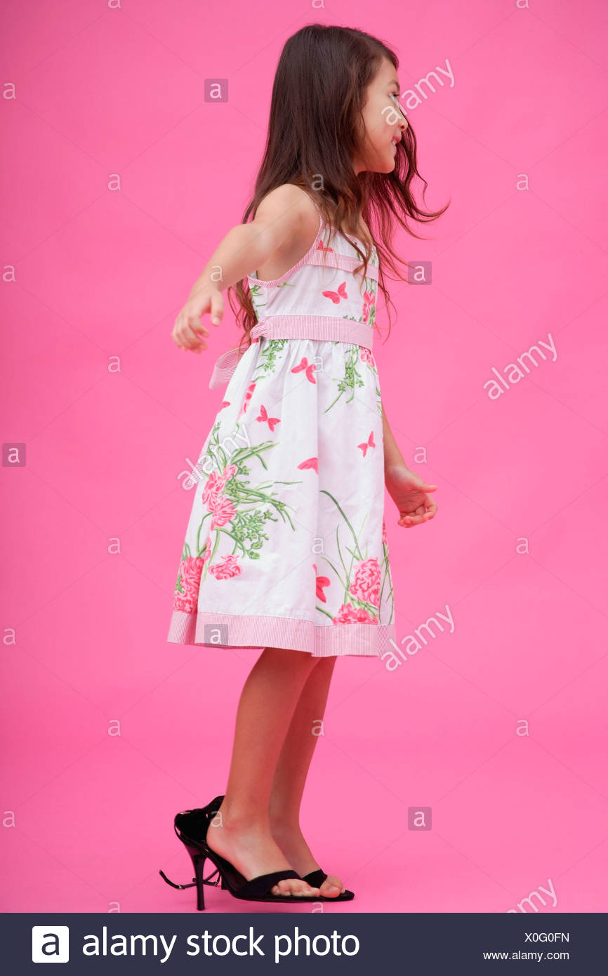Young Girl Wearing High Heel Shoes Stock Photos & Young Girl Wearing
