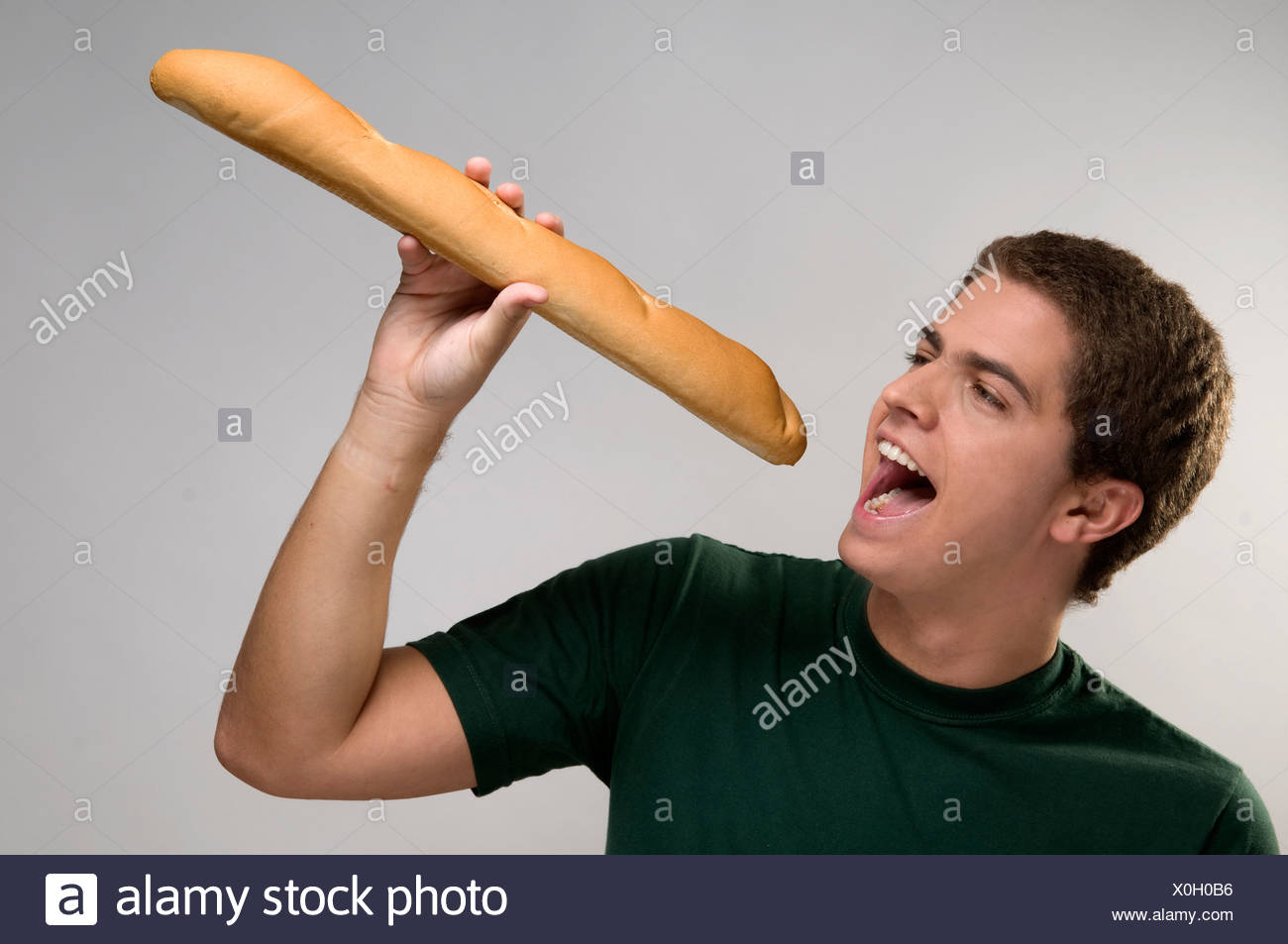 Portrait Of A Man Holding A Baguette Stock Photo Alamy