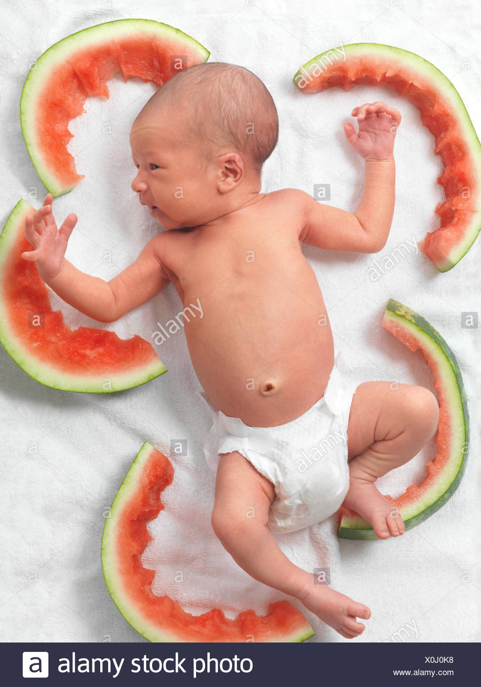 Newborn Baby In A Diaper Lying Down Amongst Watermelon Rinds Stock Photo Alamy