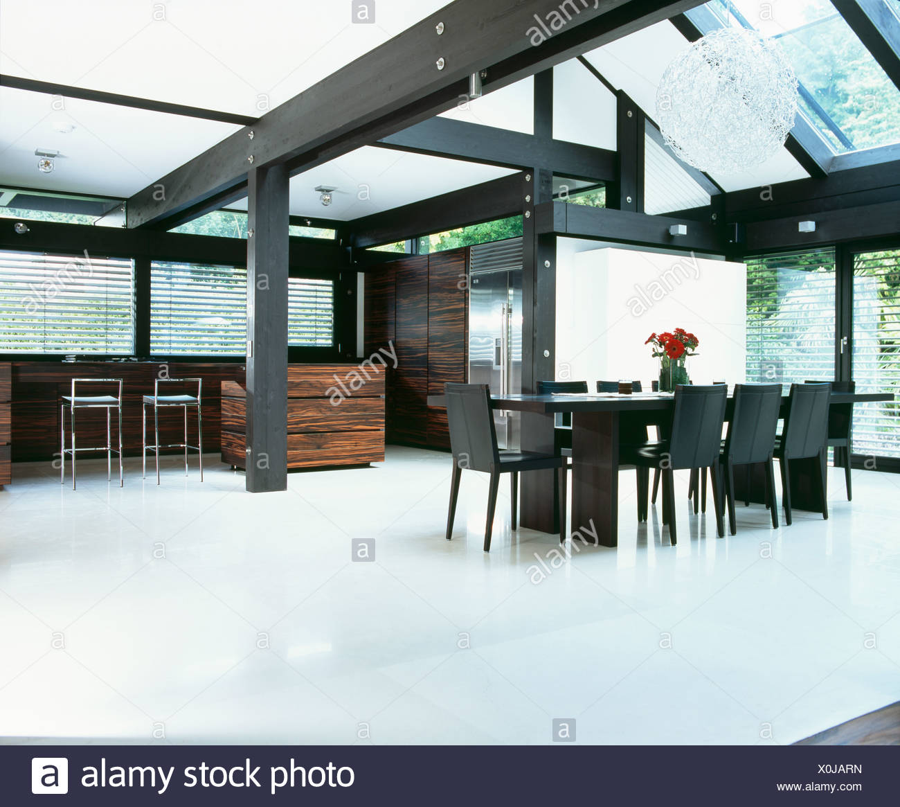 White Flooring And Black Beams In Large White Dining Room