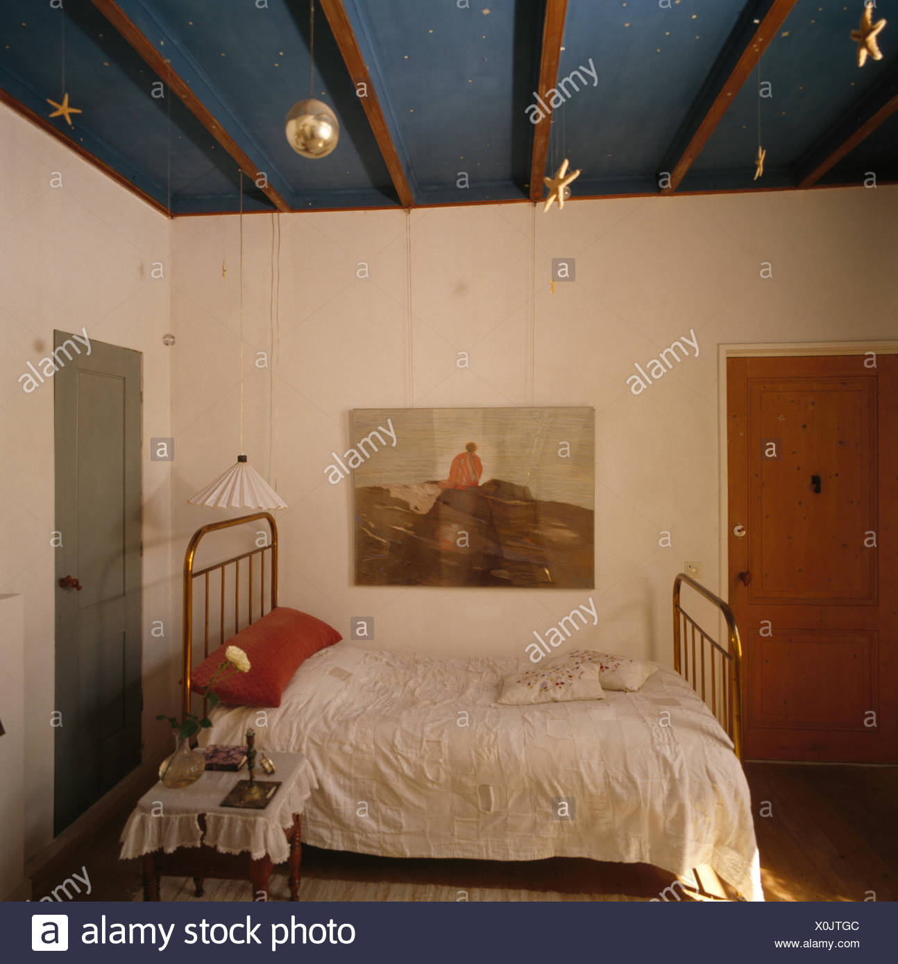 Picture On Wall Above Brass Bed In Eighties Swedish Bedroom