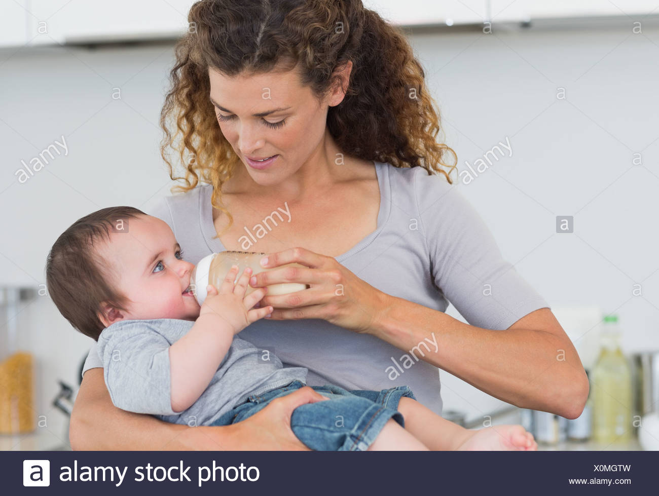 beautiful mother feeding baby