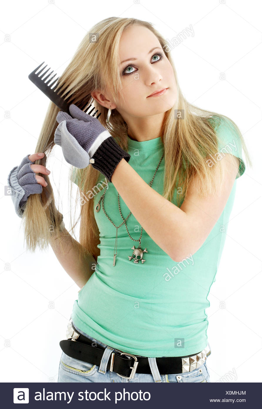 Picture Of Hair Combing Teenager Girl Over White Stock Photo
