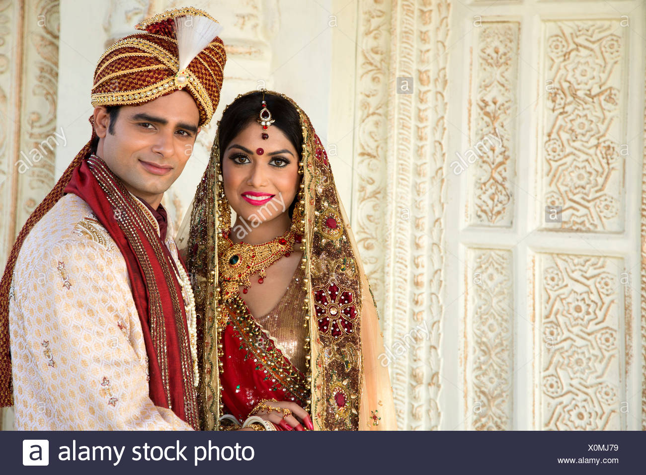 Indian Bride And Groom In Traditional Wedding Dress Stock Photo