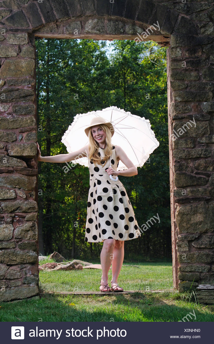 Usa New Jersey Woman In Summer Dress Standing In Door Of Country