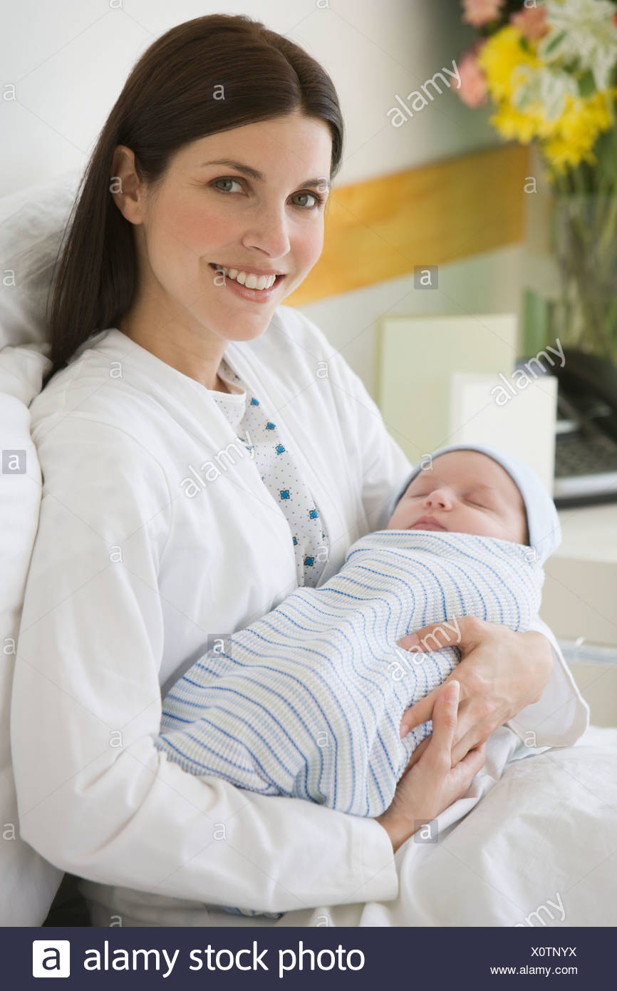 Holding babies at hospitals